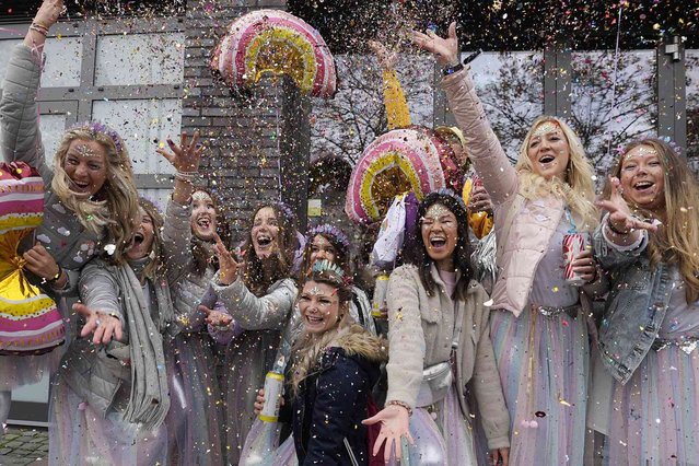 Carnival revellers celebrate during the start of the carnival season in the streets of Cologne, Germany, Saturday, November 11, 2023. (Photo by Martin Meissner/AP Photo)