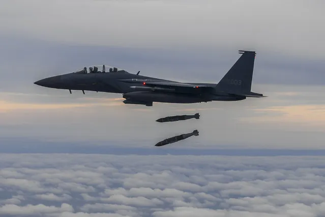 In this handout image released by the South Korean Defense Ministry, A South Korean F-15K fighter fires two Joint Direct Attack Munition (JADAM) bombs into an island target in response to North Korea's intermediate-range ballistic missile (IRBM) launch earlier in the day, on October 04, 2022 at an undisclosed location. North Korea fired an intermediate-range ballistic missile (IRBM) over Japan on Tuesday in its first launch of an IRBM in eight months, according to South Korea’s military. (Photo by South Korean Defense Ministry via Getty Images)