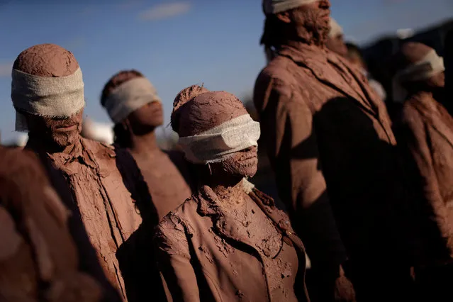 Artists from the Deviation Collective group take part in the performance called “Cegos” or Blind, in front of the Planalto Palace, in Brasilia, Brazil, August 25, 2016. (Photo by Ueslei Marcelino/Reuters)