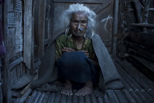 “YagYang”. The Apatani are tribal people living in north east of India in the region of Arunachal Pradesh. Tattooing and stuffing of large nose plugs is the particularity of these women. YagYang 75 years old, her husband passed away few months ago and she feels very alone, during my visit I was very fond of this woman and I wanted to spend some more time with her, so I asked her which was her favorite dish. Photo location: India. (Photo and caption by Passarini Mattia/National Geographic Photo Contest)