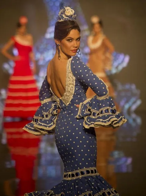 Models wear a creation by Spanish designer Carmen Vega during the International Flamenco Fashion Show in Seville, Spain on Saturday, February 2, 2013. (Photo by Miguel Angel Morenatti/AP Photo)