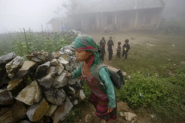 Pupils of the Hmong ethnic tribe return home from school along a hillside path at Van Chai village in Dong Van district of Vietnam's northern province of Ha Giang, located at the border with China, September 21, 2015. (Photo by Reuters/Kham)