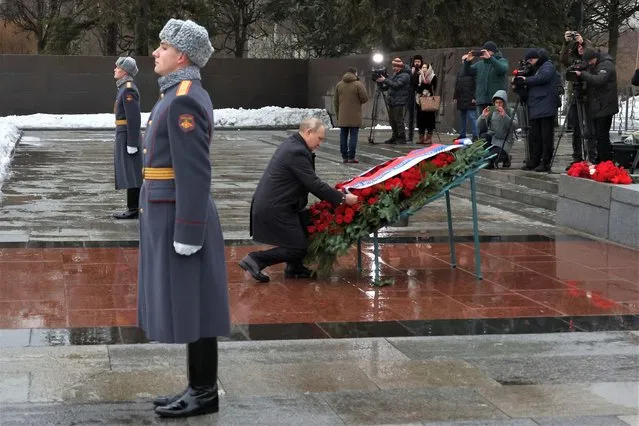 Russian President Vladimir Putin attends events marking the 80th anniversary of the break of Nazi's siege of Leningrad, (now St. Petersburg) during World War Two at the Piskaryovskoye Memorial Cemetery, where hundreds of thousands of siege victims are buried, in St. Petersburg, Russia, Wednesday, January 18, 2023. The Red Army broke the nearly 900-day blockade of the city on January 19, 1943 after fierce fighting. (Photo by Mikhail Klimentyev, Sputnik, Kremlin Pool Photo via AP Photo)