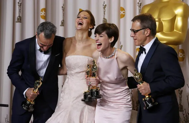 Daniel Day Lewis (L), best actor winner for “Lincoln”, Jennifer Lawrence, best actress winner for “Silver Linings Playbook”, Anne Hathaway, best supporting actress winner for “Les Miserables” and Christoph Waltz, best supporting actor winner for “Django Unchained”, pose with their Oscars backstage at the 85th Academy Awards in Hollywood, California, February 24, 2013. (Photo by Mike Blake/Reuters)