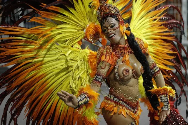 A member of the samba school Grupo Especial Mocidade Alegre participates in the carnival celebration at the Anhembi sambodrome in Sao Paulo, Brazil, 11 February 2018. (Photo by Sebastiao Moreira/EPA/EFE)
