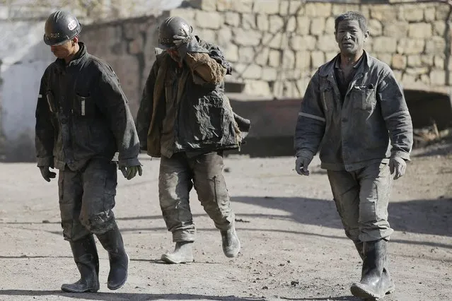 Miners walk at a coal mine from the state-owned Longmay Group on the outskirts of Jixi, in Heilongjiang province, China, October 24, 2015. (Photo by Jason Lee/Reuters)