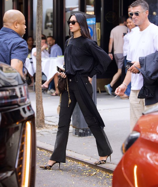 Singer Dua Lipa was spotted making a super stylish outing for lunch in the West Village on September 16, 2025. She stopped at fan favorite Via Carota in the West Village, famous for celebrity sightings. She wore a polka dot blouse with Chrome Hearts skinny black jeans and a Fall Chloé Heart shaped bag with golden chain tassles. The bag came fit with a craftfully engraved heart shaped lock. She finished her city slicker look with a pair of Manolo Blahnik calf skin pumps in Giraffe and Tom Ford Sunglasses. (Photo by usasales/Backgrid USA)