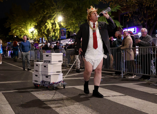 A participant mimicking the US President Donald Trump.take part in the 38th Annual 17th Street High Heel Race in the Dupont Circle neighbourhood of Washington, DC, USA, on October 28, 2025. Since 1986, costumed drag queens and others in the LGBTQ community have participated in the race held on the Tuesday before Halloween. (Photo by Gent Shkullaku/ZUMA Press Wire/Rex Features/Shutterstock)