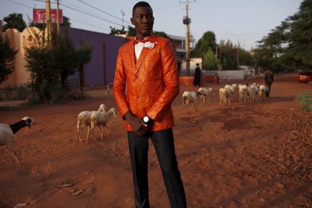 A model poses for a picture in a bazin suit made by designer Barros Coulibaly in Bamako, Mali, October 21, 2015. (Photo by Joe Penney/Reuters)