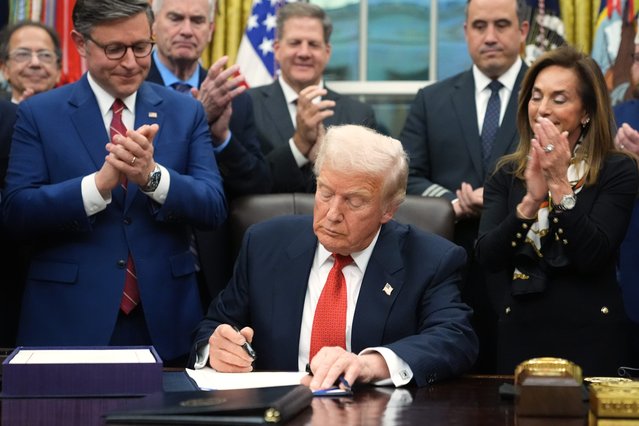 U.S. House Speaker Mike Johnson (R-LA) applauds as U.S. President Donald Trump signs the funding bill to end the U.S. government shutdown, at the White House in Washington, D.C., U.S., November 12, 2025. (Photo by Kevin Lamarque/Reuters)