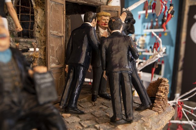 A figurine depicting the bloody face of Donald Trump is seen in San Gregorio Armeno (the famous Neapolitan street of nativity scenes) following his attempted assassination in July 13 Pennsylvania rally, in Naples, Italy on July 16, 2024. (Photo by Stringer/Anadolu via Getty Images)
