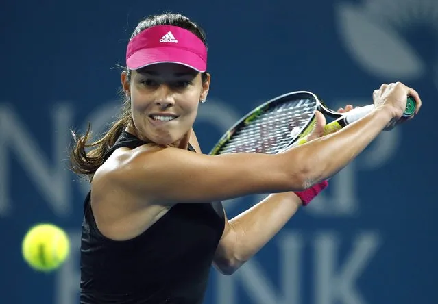 Ana Ivanovic of Serbia plays a backhand return to Maria Sharapova of Russia during their women's singles final match at the Brisbane International tennis tournament in Brisbane, January 10, 2015. (Photo by Jason Reed/Reuters)