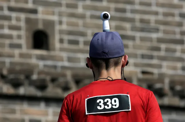 A participant wears a camera on his head during the Great Wall Marathon at the Huangyaguan section of the Great Wall of China, in Jixian of Tianjin, China May 19, 2018. (Photo by Jason Lee/Reuters)