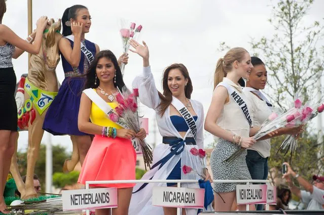 Miss Myanmar 2014 Sharr Htut Eaindra, Miss Netherlands 2014 Yasmin Verheijen, Miss Nicaragua 2014 Marline Barberena, Miss New Zealand 2014 Rachel Millns and Miss Nigeria 2014 Queen Celestine take part in a cultural parade and festival in Miami in this January 11, 2015 picture provided by the Miss Universe Organization. (Photo by Reuters/Miss Universe Organization)