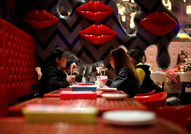 Guests enjoy drinks and food at Kawaii Monster Cafe amid the coronavirus disease (COVID-19) outbreak, in Tokyo, Japan on January 31, 2021. (Photo by Issei Kato/Reuters)