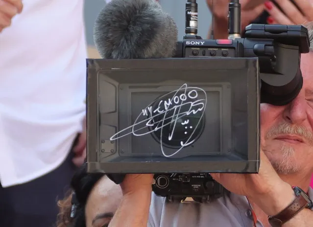A camera lens with the signature of Novak Djokovic of Serbia after winning his the Men's Singles 3rd round match against Alejandro Davidovich Fokina of Spain during the French Open Grand Slam tennis tournament at Roland Garros in Paris, France, 02 June 2023. (Photo by Teresa Suarez/EPA)