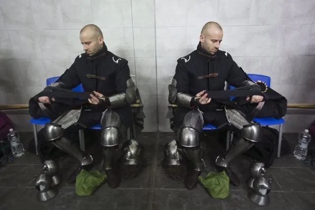 A competitor from Denmark is seen at the dressing room during the “World Medieval Fighting Championship – the Israeli Challenge” in Rishon Letzion near Tel Aviv on January 22, 2015. (Photo by Amir Cohen/Reuters)