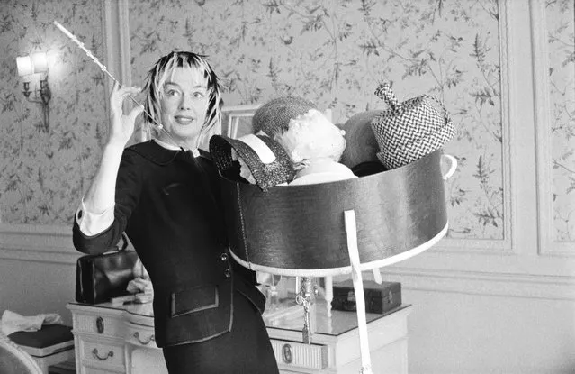 American actress Rosalind Russell (1907 – 1976) holding a collection of hats, 22nd August 1958. (Photo by McKeown/Daily Express/Hulton Archive/Getty Images)