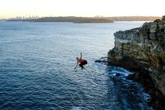 One inch from flying. Lorraine Dawes highlines on a one-inch wide slackline above crashing waves in Sydney. (Photo by Aidan Williams/Women in Sport Photo Action Awards 2021)