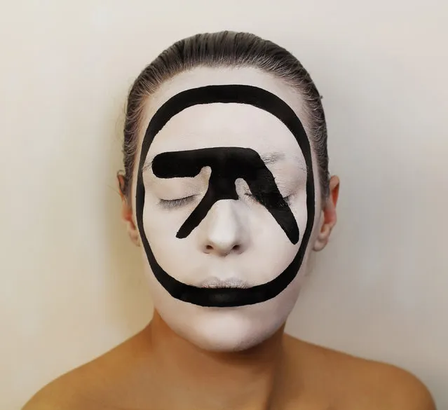 Aphex Twin album. An artist has gone to incredible lengths to paint several iconic album covers on her own face. (Photo by Natalie Sharp/Caters News)