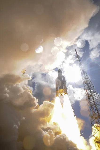 This photo taken and released on November 17, 2016 by the European Space Agency (ESA) shows the Ariane 5 rocket with a payload of four Galileo satellites lifting off from ESA' s European Spaceport in Kourou, French Guiana. Ariane 5 successfully launched on November 17 four satellites which will be part of the Galileo global satellite navigation system. (Photo by Stephane Corvaja/ESA)