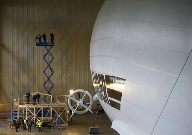 Members of the media film the Airlander 10 hybrid airship during its unveiling in Cardington, Britain March 21, 2016. (Photo by Darren Staples/Reuters)