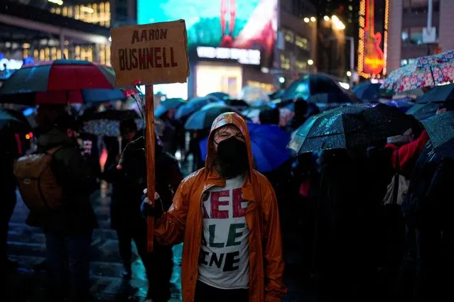 A person holds a placard at a vigil and protest held outside a U.S. military recruiting center for U.S. Airman Aaron Bushnell, who died after setting himself on fire in front of the Israeli Embassy in Washington on February 25 in an apparent act of protest against the war in Gaza between Israel and the Palestinian Islamist group Hamas, in New York on February 28, 2024. (Photo by Adam Gray/Reuters)