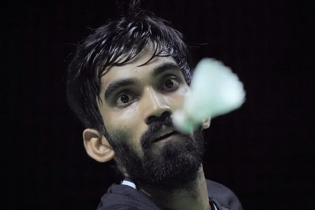India's Srikanth Kidambi eyes the shuttlecock as he competes against France' Toma Junior Popov during their men's doubles Group B badminton match at the BWF World Tour Finals in Nusa Dua, Bali, Indonesia, Wednesday, December 1, 2021. (Photo by Dita Alangkara/AP Photo)