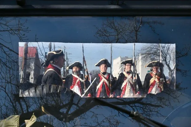 Members of the 1st Virginia Regiment of the Continental Line are seen through the window of an Army vehicle as they prepare to take part in the George Washington Birthday Parade on Monday February 19, 2024 in Alexandria, VA. (Photo by Matt McClain/The Washington Post)