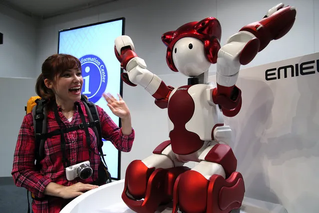 Japanese electronics giant Hitachi unveils the new humanoid robot Emiew3 in Tokyo on Thursday, April 8, 2016. The 90cm tall 15kg Emiew3 enables to move maximum speed of 6km/h and talk with guests interactively. Hitachi will start field tests soon and expects to put the service robot on the market in 2018. (Photo by Aflo/Splash News)