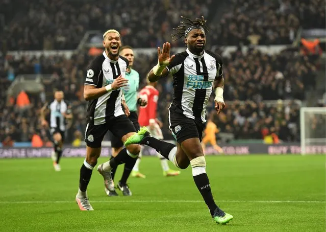 Newcastle United's Allan Saint-Maximin (R) celebrates scoring their side's first goal of the game during the Premier League match at St. James' Park, Newcastle on Monday December 27, 2021. (Photo by Richard Lee/Rex Features/Shutterstock)