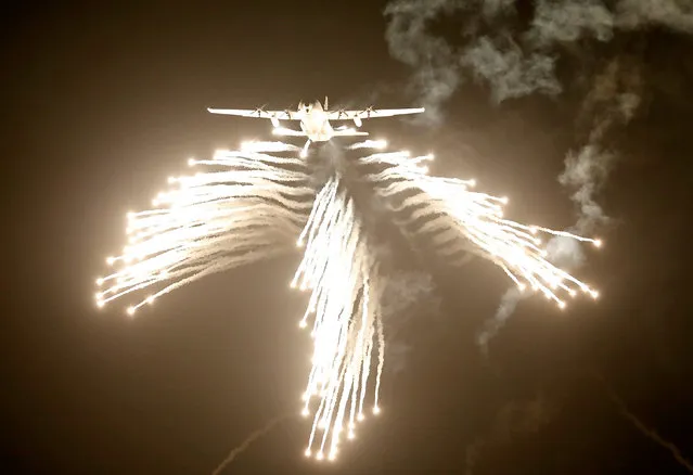 A U.S.-made C-130J Hercules aircraft of the Indian Air Force (IAF) fires flares during "Vayu Shakti", or Air Power exercise in Pokhran, Rajasthan state, India, February 16, 2019. (Photo by Amit Dave/Reuters)