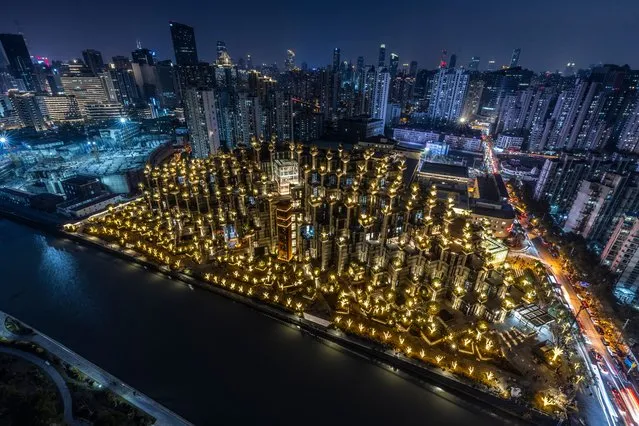 The 1,000 Trees shopping center in Shanghai, China, 02 January 2022. Visitors have been attracted by the unconventional appearance of the landmark shopping complex with trees planted on its pillars and balconies. Located along the Suzhou Creek, the 1,000 Trees complex includes art galleries, museums, restaurants, and entertainment sites. (Photo by Alex Plavevski/EPA/EFE)