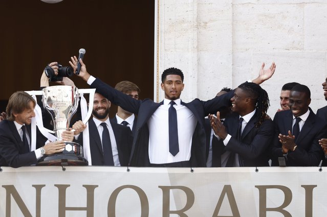 Real Madrid's player Jude Bellingham (C) greets supporters from the balcony of Madrid's regional Government headquarters during Real Madrid's LaLiga title celebrations in Madrid, Spain, 12 May 2024. (Photo by Daniel Gonzalez/EPA/EFE)