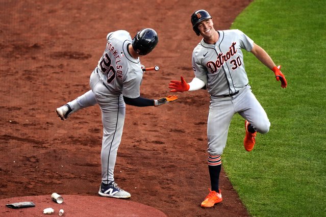 Detroit Tigers' Kerry Carpenter (30) celebrates with Spencer Torkelson (20) after hitting a solo home run during the fourth inning of a baseball game against the Kansas City Royals Monday, May 20, 2024, in Kansas City, Mo. (Phoot by Charlie Riedel/AP Photo)