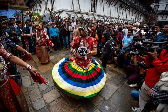 Masked dancers perform on the first day of Indra Jatra Festival at Hanumandhoka Durbar Square in Kathmandu, Nepal, September 10, 2019. The eight-day festival celebrates Indra, the god of rain, to mark the end of the monsoon. (Photo by Sulav Shrestha/Xinhua News Agency/Barcroft Media)