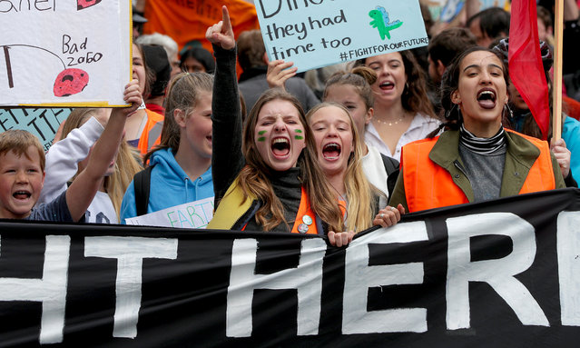 Climate change supporters march down Queen Street to Quay Street on September 27, 2019 in Auckland, New Zealand. Rallies held across New Zealand are part of a global movement for mass days of action demanding global leaders take measures to address the climate crisis. (Photo by Dave Rowland/Getty Images)