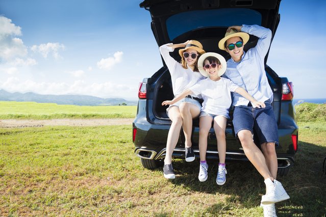 Happy family enjoying road trip and summer vacation. (Photo by Tom Wang/Rex Features/Shutterstock)