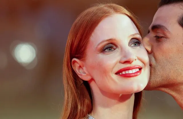 Actors Jessica Chastain and Oscar Isaac pose on the read carpet screening of the film “Scenes From A Marriage” out of competition at the Venice Film Festival in Venice, Italy on September 4, 2021. (Photo by Yara Nardi/Reuters)