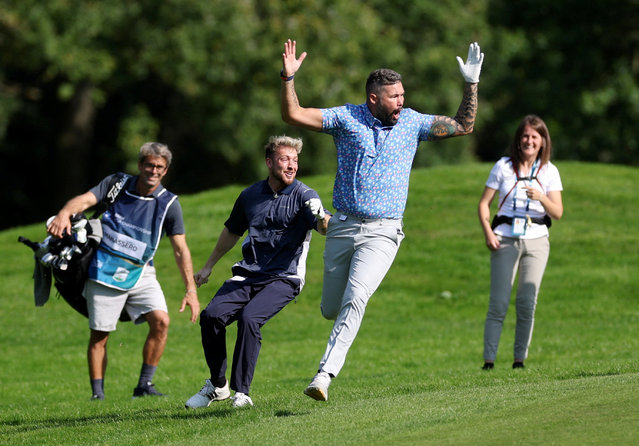 Former English boxer Tony Bellew celebrates an albatross during the BMW PGA Championship at Wentworth Club, Virginia Water, Britain on September 18, 2024. (Photo by Paul Childs/Action Images via Reuters)