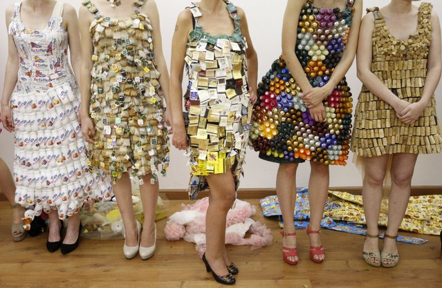 Models wait backstage, during an eco-clothing fashion show from recycled materials by French designer Isagus Toche, in Kiev, Ukraine, on 23 June 2017. (Photo by Stepan Franko/EPA/EFE)