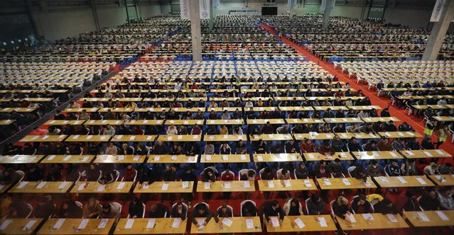 More than 9,700 Candidates take part in an examination to try to get one of the public sector jobs offered by state-run Correos postal service in the town of Sailleda, Galicia, northwestern Spain, 19 January 2020. More than 166,000 people attended the entrance exams held in several Spanish cities to get one of the 4,500 public jobs tendered by Correos, the biggest selection for Correos service held in Spain over the last decade. (Photo by Lavandeira Jr./EPA/EFE)