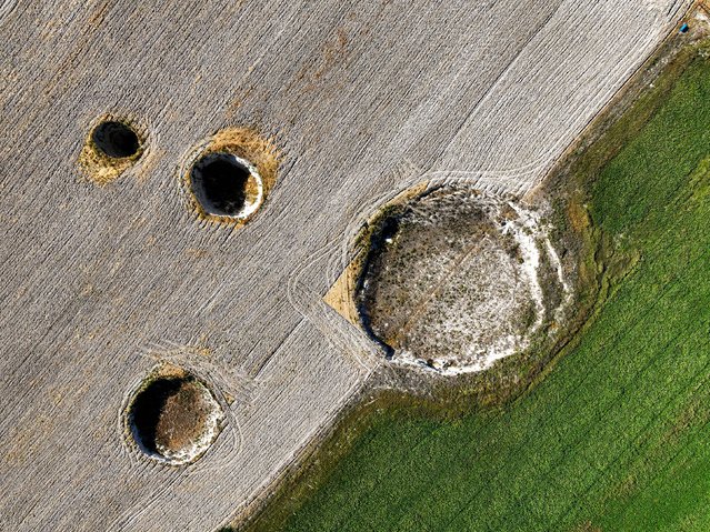 An aerial view of sinkholes (obruk), caused by some form of collapse of the surface layer, in Konya, Turkiye on September 17, 2024. Many sinkholes are observed in the fields of Eseli Plateau located within the borders of Resadiye Neighborhood in the north-west of Karapinar district, where sinkhole formation has increased rapidly in recent years. (Photo by Serhat Cetinkaya/Anadolu via Getty Images)