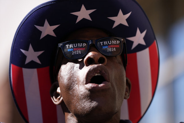 A supporter yells at reporters while waiting to attend a campaign rally with Republican presidential nominee former President Donald Trump at Santander Arena, Wednesday, October 9, 2024, in Reading, Pa. (Photo by Matt Slocum/AP Photo)