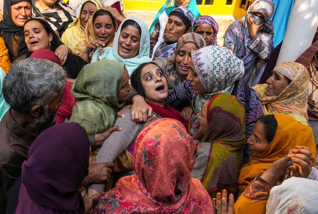 A family member cries of Kashmiri doctor Shahnawaz who was among those killed when gunmen fired at people working on a strategic tunnel project in Indian-controlled Kashmir, at Nadigam village, southwest of Srinagar, Monday, October 21, 2024. (Photo by Mukhtar Khan/AP Photo)