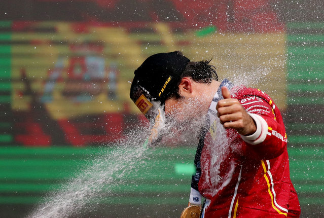 Ferrari's Carlos Sainz Jr. celebrates on the podium after winning the F1 Mexico City Grand Prix in Mexico City on October 27, 2024. (Photo by Henry Romero/Reuters)