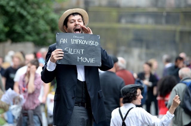 Edinburgh Festival Fringe entertainers perform on the Royal Mile as the festival enters its final weekend. (Photo by Jeff J. Mitchell/Getty Images)