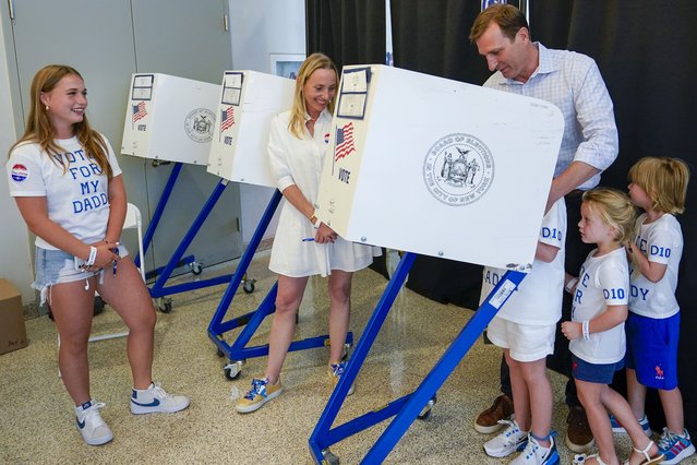 Attorney Dan Goldman, right, is joined by his family as he votes early in the Democratic primary election, Wednesday, August 17, 2022, in New York. Goldman is running in the packed Democratic primary race for New York's 10th Congressional District. (Photo by Mary Altaffer/AP Photo)