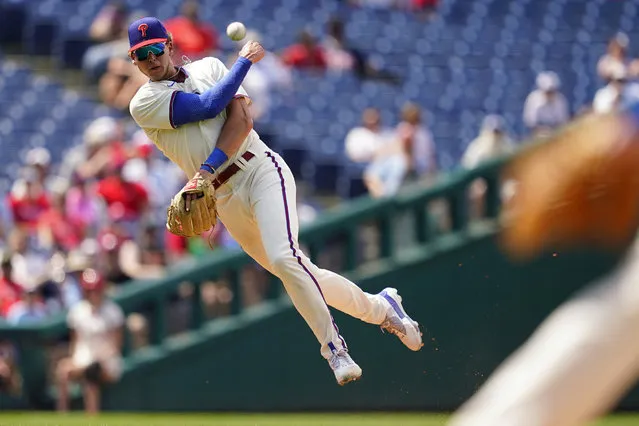Philadelphia Phillies third baseman Alec Bohm throws to first after fielding a ground out by Atlanta Braves' Michael Harris II during the eighth inning of a baseball game, Wednesday, July 27, 2022, in Philadelphia. (Photo by Matt Slocum/AP Photo)