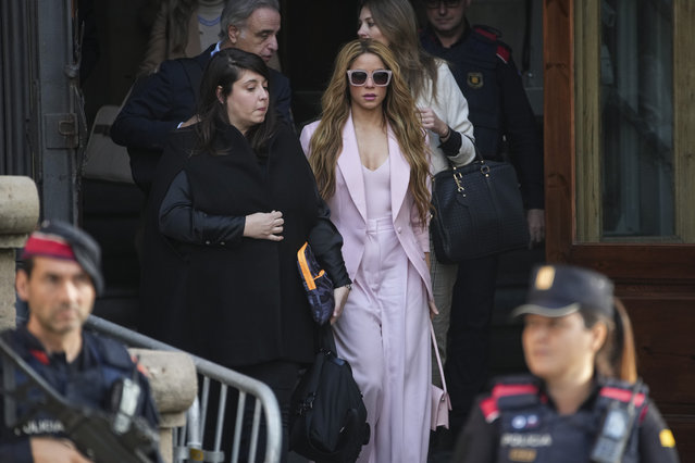Colombian performer Shakira, wearing a pink outfit, leaves court in Barcelona, Spain, Monday, November 20, 2023. Global pop star Shakira is summoned on Monday to a Barcelona courthouse for the opening day of her trial for allegedly defrauding Spanish tax officials of millions of euros. Shakira faces six counts of failing to pay the Spanish government 14.5 million euros (now $15.8 million) in taxes between 2012 and 2014. (Photo by Emilio Morenatti/AP Photo)